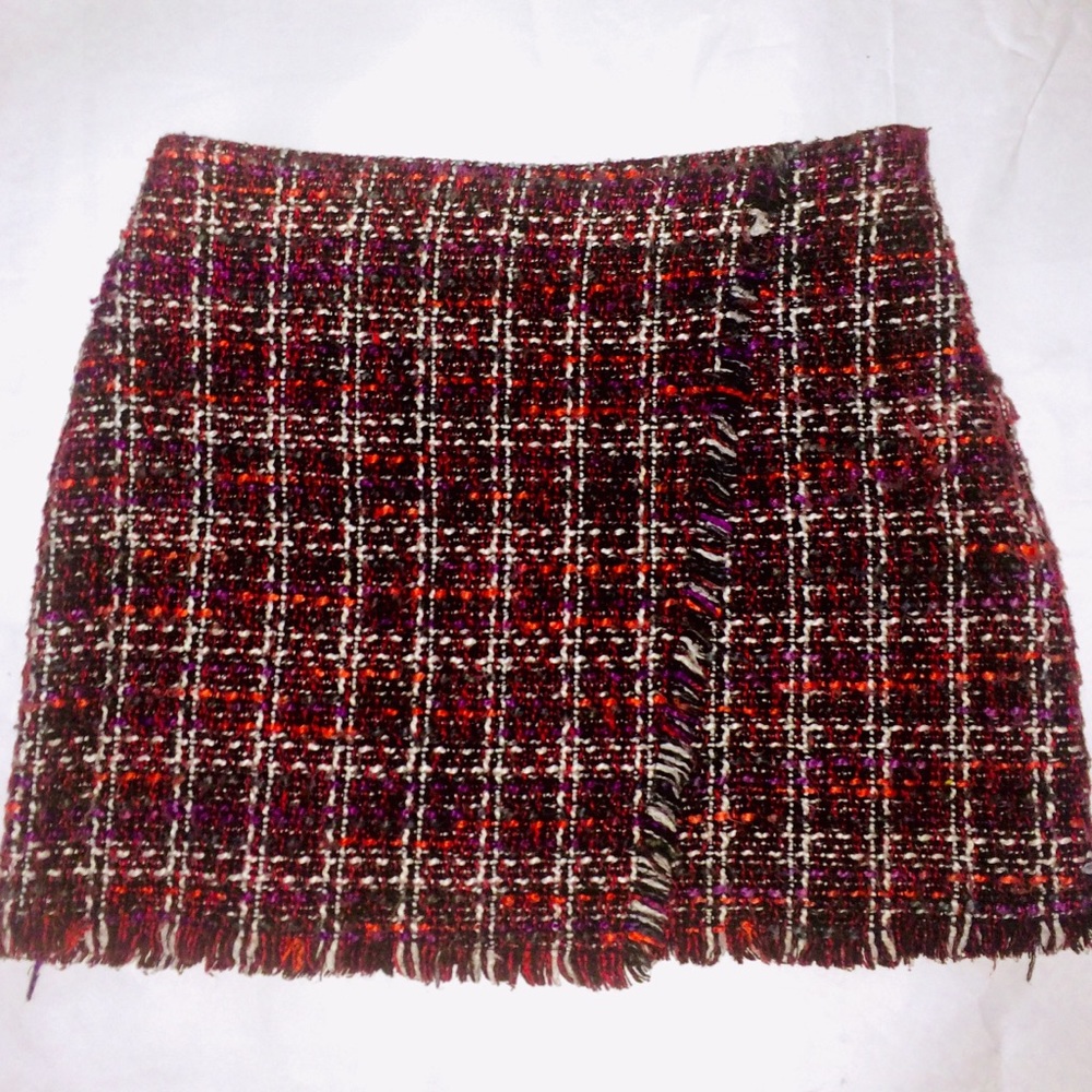 Purple, pink, and black kilt mini skirt.